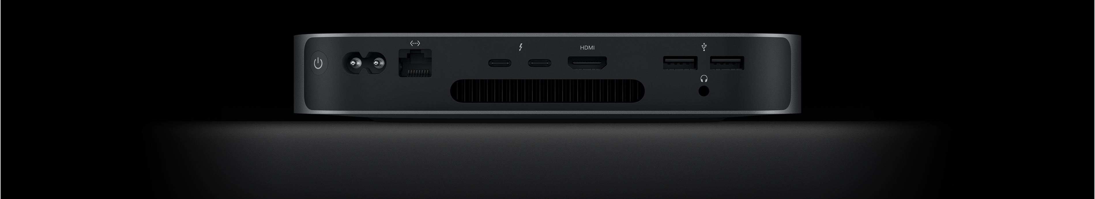 Vista posteriore di Mac mini che mostra due porte Thunderbolt 4, la porta HDMI, due porte USB-A, il jack per cuffie, la porta Gigabit Ethernet, la porta per l’alimentazione e il tasto di accensione.
